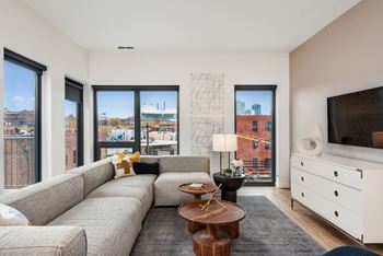Floor-to-ceiling windows with panoramic views of downtown and the crossroads